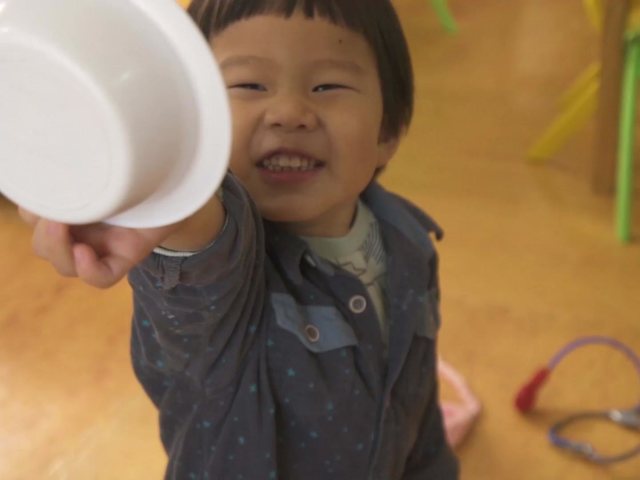 A toddler playing in a small group at Kuddles